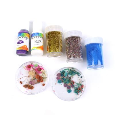 Embellishment Kit: 2 x Alcohol Inks, 2 x glitters, 1 mica powder & 2 x pots of dried flowers 